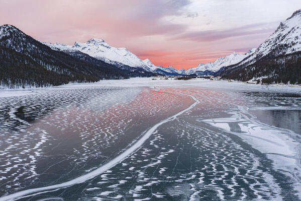 Frozen Lake Silvaplana at sunrise during the cold winter, Maloja, Engadine, Graubunden canton, Switzerland