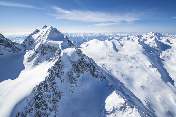 Aerial view of Piz Roseg sorrounded by huge glaciers. Val Roseg, Engadine, Canton of Grisons, Switzerland Europe