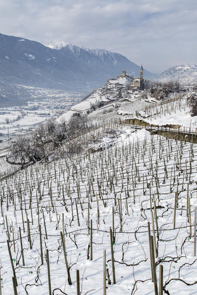 Church of San Antonio Abate and Castel Grumello in winter. Montagna, Valtellina, Lombardy, Italy Europe