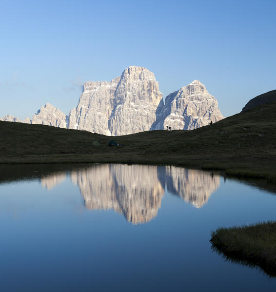 Mount Pelmo reflected in Baste Lake. Giau Pass, Dolomites of Belluno, Veneto, Italy. Europe