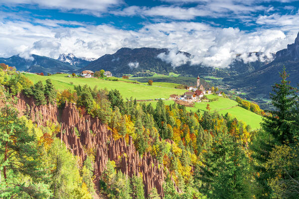 Earth pyramids natural rocks in the colorful alpine landscape in autumn, Longomoso, Renon/Ritten, Bolzano, South Tyrol, Italy