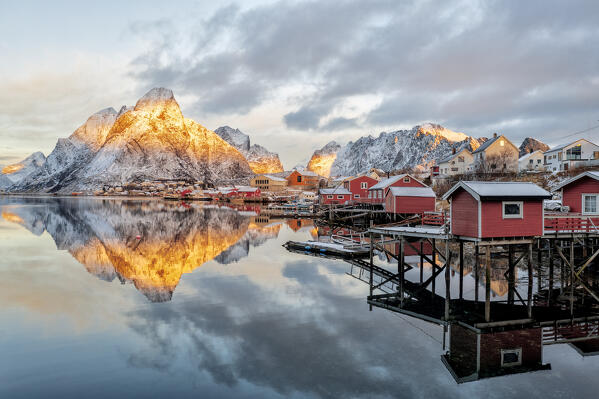 Traditional red Rorbu cabins at dawn, Reine Bay, Nordland, Lofoten Islands, Norway