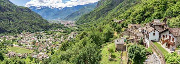 Aerial panoramic of the alpine village of Crana and Chiavenna town in summer, Piuro, Valchiavenna, Valtellina, Lombardy, Italy