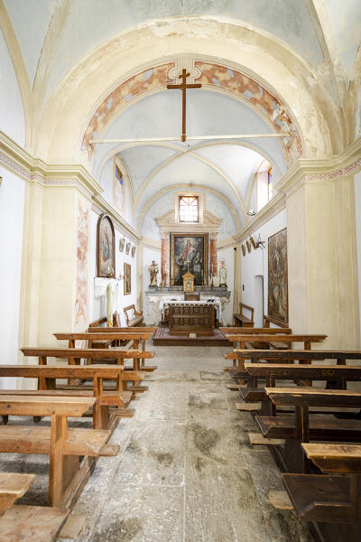 Altar and vaulted arch ceiling inside the medieval church of Crana, Piuro,  Valchiavenna, Valtellina, Lombardy, Italy