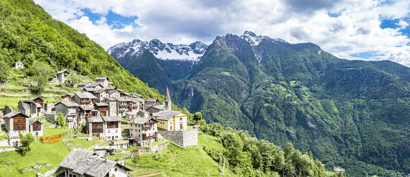 Aerial view of  traditional stone houses in the alpine village of Savogno in summer, Valchiavenna, Valtellina, Lombardy, Italy