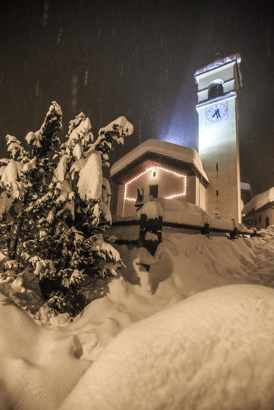 The church of Pianazzo of Madesimo under a thick snowfall. Vallespluga, Valtellina Lombardy Italy Europe