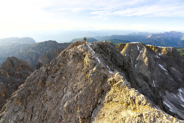 Summit cross on top of Catinaccio d'Antermoia at sunset, aerial view,  Dolomites, South Tyrol, Italy