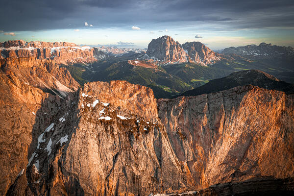 Aerial view of Sassolungo group, Sassopiatto, Sella, Gardena Valley and Seceda at sunset, Dolomites, South Tyrol, Italy