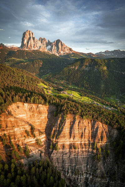 Aerial view of Sassolungo group, Sassopiatto, Gardena Valley and Seceda at sunset, Dolomites, South Tyrol, Italy