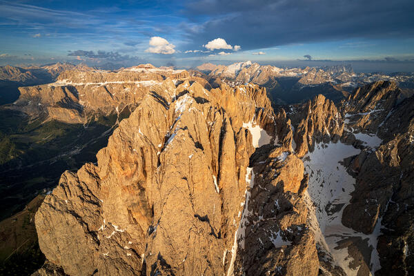 Aerial view of Sassolungo group, Marmolada and Sella mountains at sunset, Dolomites, South Tyrol, Italy