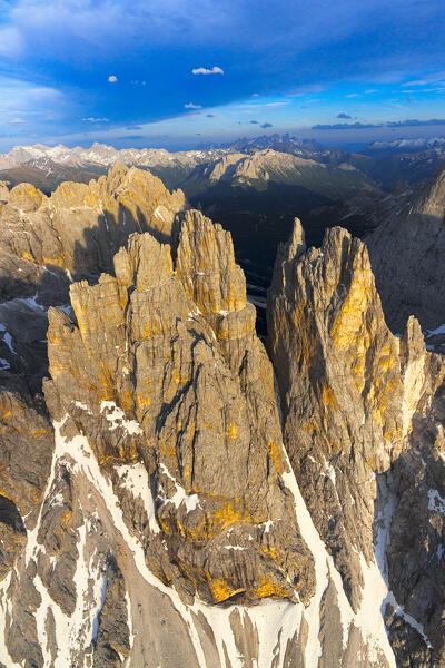 Rock pinnacles of Torri Del Vajolet at sunset, aerial view, Dolomites, South Tyrol, Italy