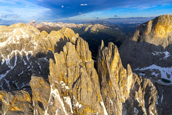 Rock pinnacles of Torri Del Vajolet at sunset, aerial view, Dolomites, South Tyrol, Italy