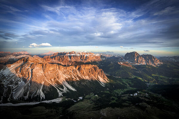 Clouds at sunset over Gardena Valley, Cirspitzen, Sella group, Sassolungo and Sassopiatto, Dolomites, South Tyrol, Italy