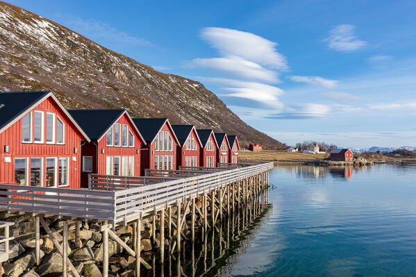 Wood red cabins overlooking the cold sea, Skreda, Leknes, Nordland county, Lofoten Islands, Norway