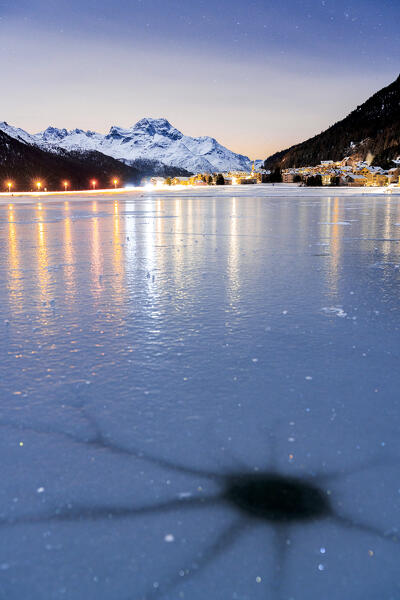 Cracked ice on the frozen surface of lake Champfer in winter, Silvaplana, canton of Graubunden, Engadine, Switzerland