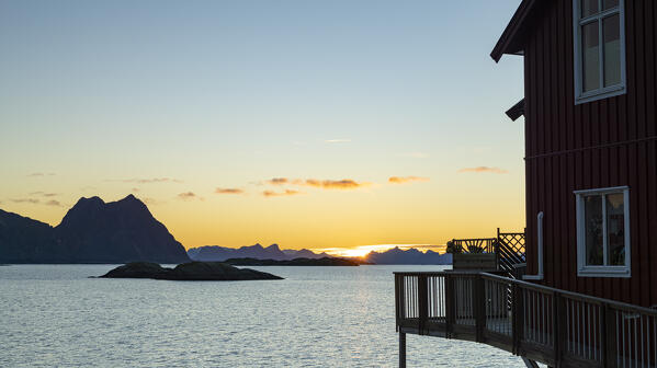 Traditional house ovelooking the sea at sunrise, Svolvaer, Nordland county, Lofoten Islands, Norway