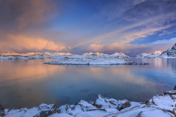 The sunrise lights up the colors on Henningsvaer fjord. Lofoten Islands. Norway. Europe