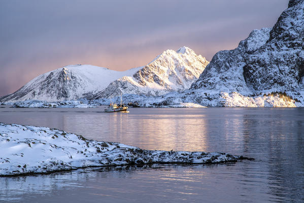 Fishing boat returning to port from a fishing trip off the coast of Henningsvaer. Lofoten Islands. Norway. Europe