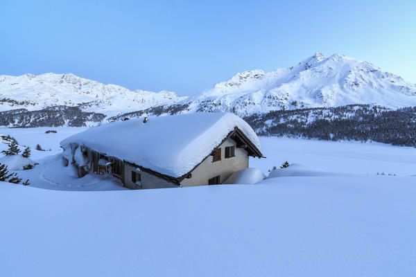 Enchanted atmosphere during the dusk at Spluga huts. Maloja Pass. Engadine. Switzerland. Europe