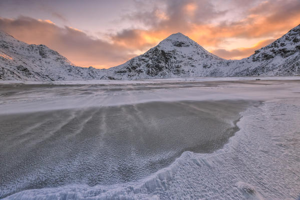 Wind blows on the cold sea of Uttakleiv at dawn.  Lofoten Islands Norway Europe