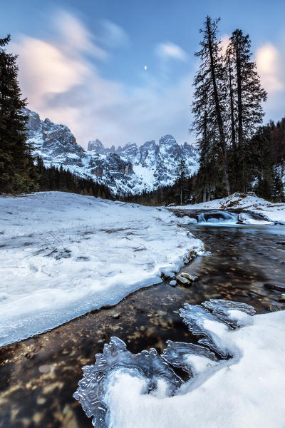 Sunset on a frozen creek. Venagia Valley Panaveggio Natural Park Dolomites Trentino Alto Adige Italy Europe