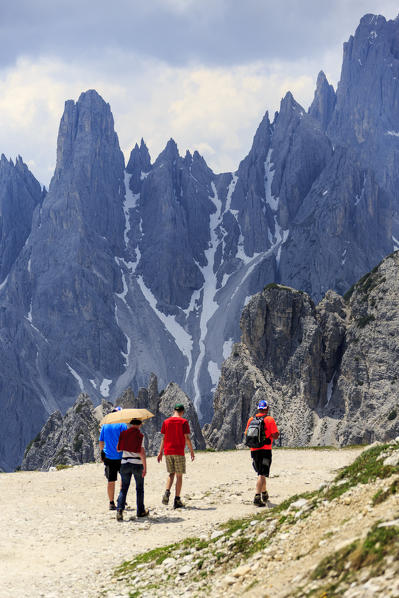 Hikers venturing to discover Cadini di  Misurina. Auronzo of Cadore Veneto Sesto Dolomites Italy Europe