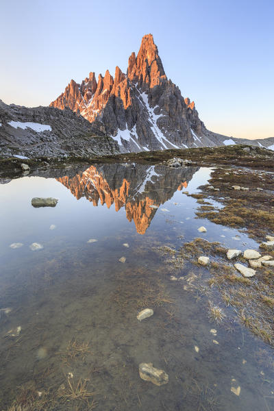 Dawn illuminates Mount Paterno reflected in the lake. Sesto Dolomites Trentino Alto Adige Italy Europe