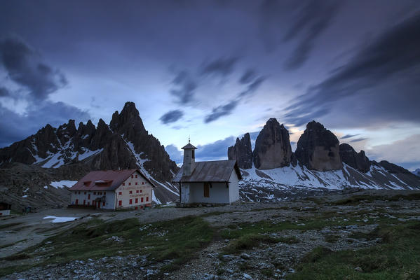 Last lights of sunset over Refuge Locatelli and the Three Peaks of Lavaredo Sesto Dolomites Trentino Alto Adige Italy Europe