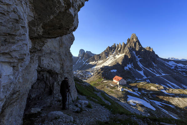 Photographer in action near the Three Peaks of Lavaredo and Refuge Locatelli. Sesto Dolomites Trentino Alto Adige Italy Europe