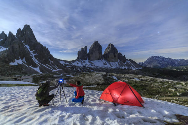 Photographers in action near the Three Peaks of Lavaredo at night. Sesto Dolomites Trentino Alto Adige Italy Europe