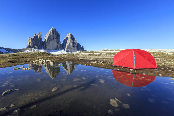 Hikers tent in front of the Three Peaks of Lavaredo at sunrise. Sesto Dolomites Trentino Alto Adige Italy Europe