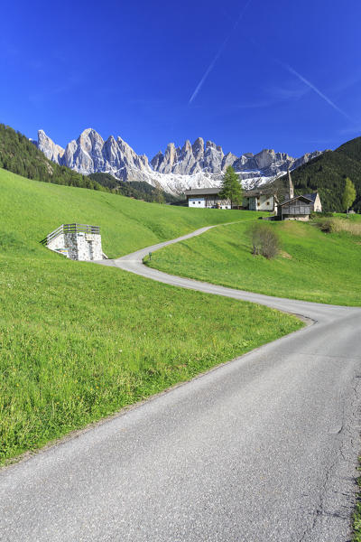 The village of St. Magdalene surrounded by green meadows at the foot of the Odle Funes Valley South Tyrol Dolomites Italy Europe