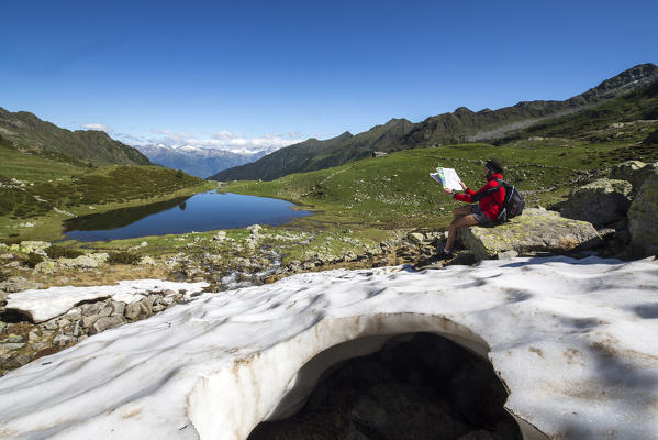 Hiker at Lakes Porcile Tartano Valley Orobie Alps Lombardy Italy Europe