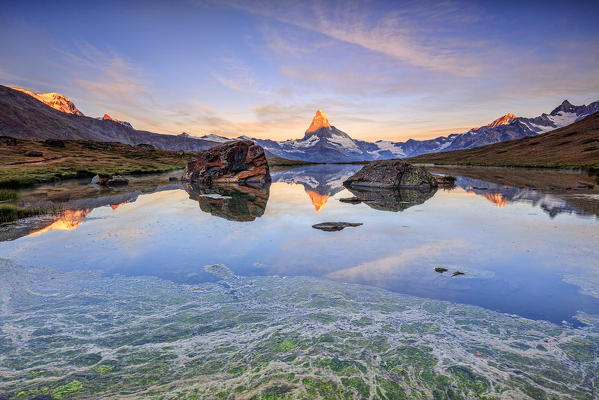 The Matterhorn reflected in Lake Stellisee at dawn Zermatt Pennine Alps Canton of Valais Switzerland Europe