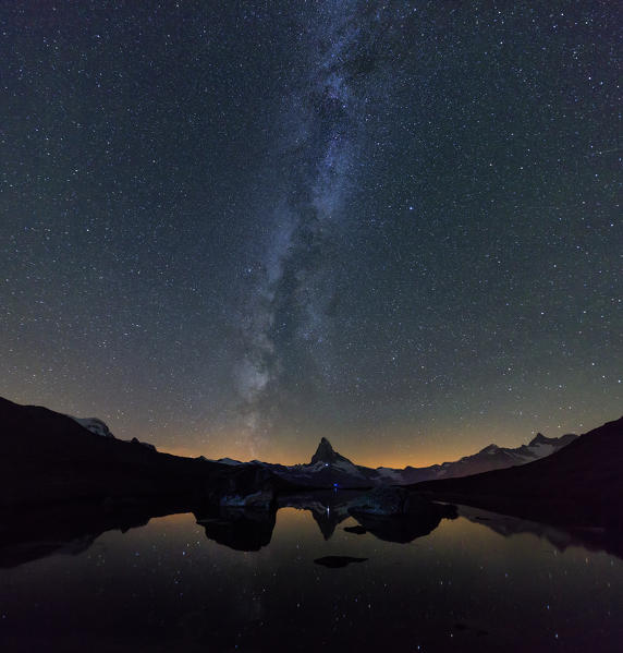 Stars and Milky Way above the Matterhorn reflected in Lake Stellisee Zermatt Canton of Valais Switzerland Europe
