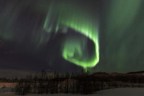 Aurora borealis on the snowy landscape at Tromsø Lyngen Alps Lapland Norway Europe