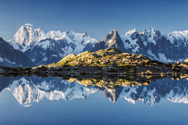 Snowy peaks of Dent Du Geant and Grandes Jorasses are reflected in Lac Blanc Haute Savoie France Europe