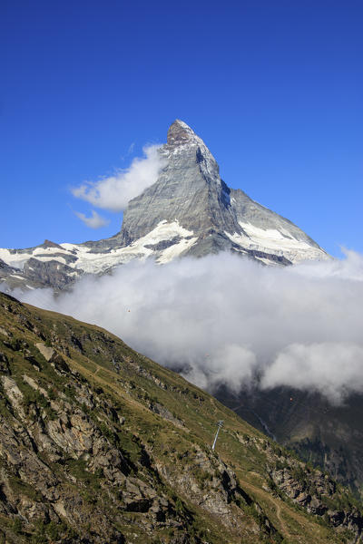 View of Matterhorn framed by clouds and blue sky in a summer day Gornergrat Valais Switzerland Europe