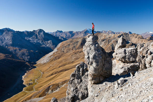 Hikers climb the Rims peaks. Stelvio. Lombardy. Italy Europe