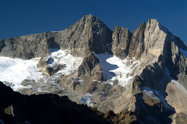 The granite peaks of Red and Vazzeda dominate the Val Sissone famous for the crystals. Valtellina. Lombardy Italy Europe