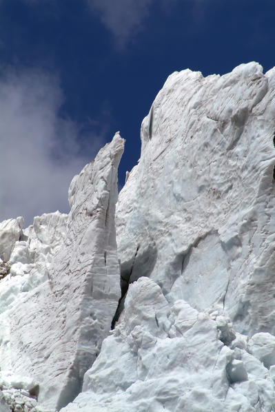 Ice wall teetering on Fellaria glacier which is also affected by the global melting. Valmalenco. Valtellina Lombardy. Italy Europe 