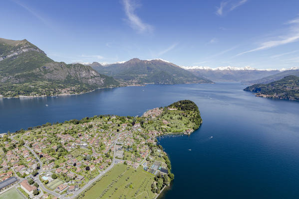 Aerial view of the village of Bellagio frames by the blue Lake Como and snowy peaks in background Lombardy Italy Europe