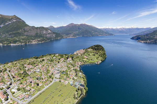 Aerial view of the village of Bellagio frames by the blue Lake Como and snowy peaks in background Lombardy Italy Europe