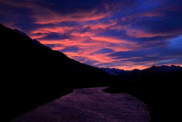 The amazing colours of a sunset in lower Valtellina, Lombardy Italy Europe