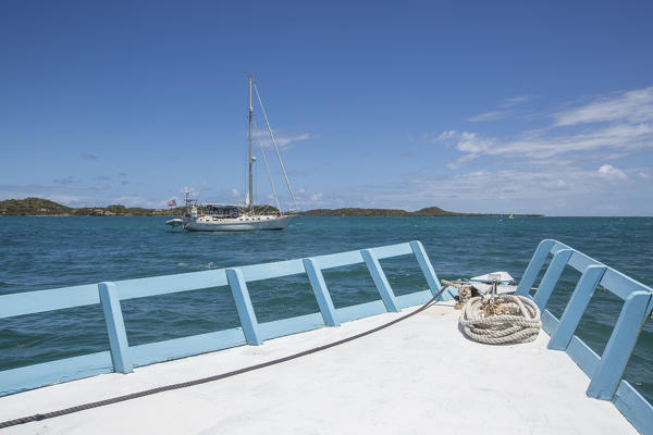 Sailboats and vessels in the turquoise waters of the Caribbean Sea Green Island Antigua and Barbuda Leeward Island West Indies