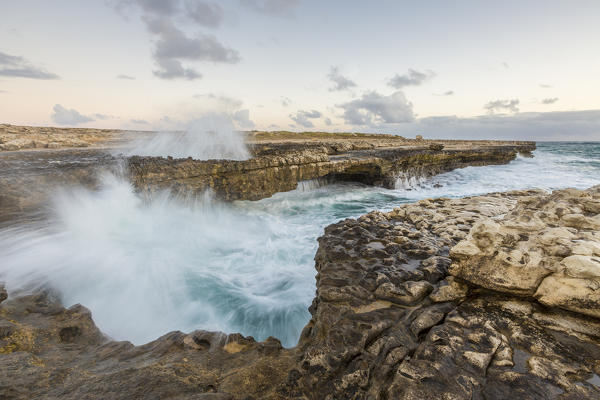 Waves of the rough sea crashing on the  cliffs of Devil's Bridge Caribbean Antigua and Barbuda Leeward Islands West Indies