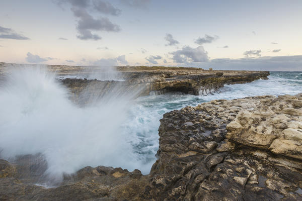 Waves of the rough sea crashing on the  cliffs of Devil's Bridge Caribbean Antigua and Barbuda Leeward Islands West Indies