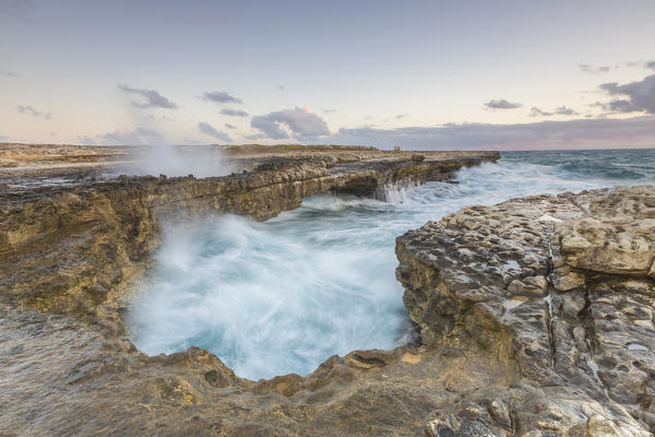 Waves of the rough sea crashing on the  cliffs of Devil's Bridge Caribbean Antigua and Barbuda Leeward Islands West Indies