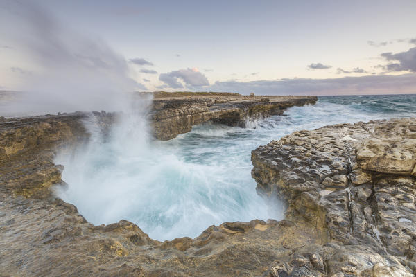 Waves of the rough sea crashing on the  cliffs of Devil's Bridge Caribbean Antigua and Barbuda Leeward Islands West Indies