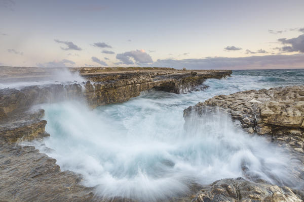 Waves of the rough sea crashing on the  cliffs of Devil's Bridge Caribbean Antigua and Barbuda Leeward Islands West Indies